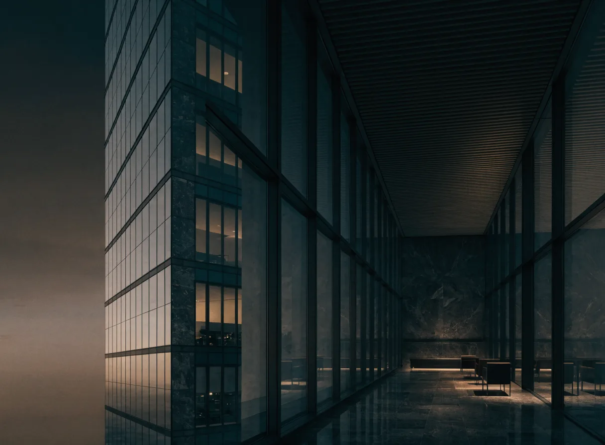 Glass office tower interior at dusk